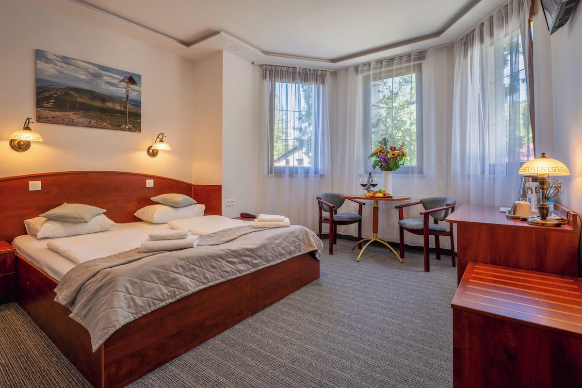 Double or Twin Room | Desk, blackout drapes, iron/ironing board, free cribs/infant beds