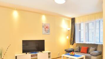 Deluxe Studio, Balcony | Living area | Flat-screen TV