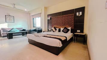 Deluxe Room | 1 bedroom, in-room safe, individually furnished, desk