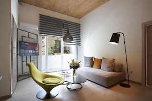 Family Apartment, Balcony | Living area | 40-inch flat-screen TV with digital channels, TV, Netflix