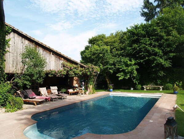 Outdoor pool, open 11:00 AM to 7:00 PM, pool umbrellas, pool loungers