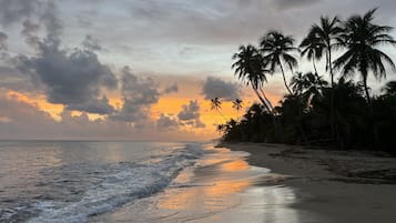 Beach nearby, white sand, beach towels