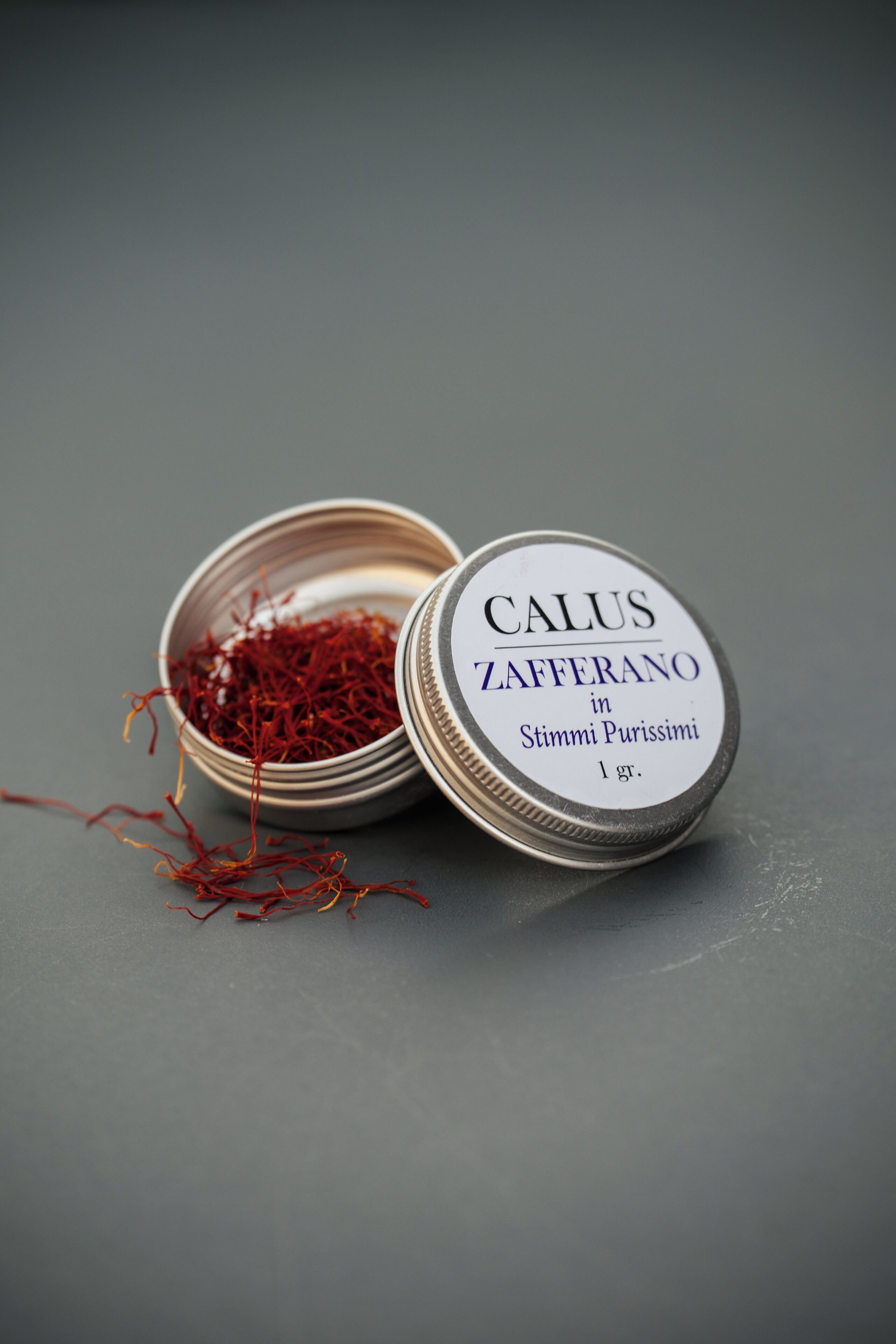 A container with a label indicating it contains saffron.