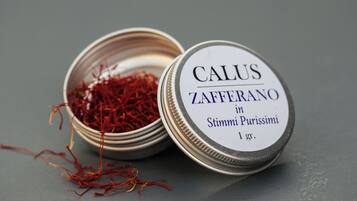 A container with a label indicating it contains saffron.