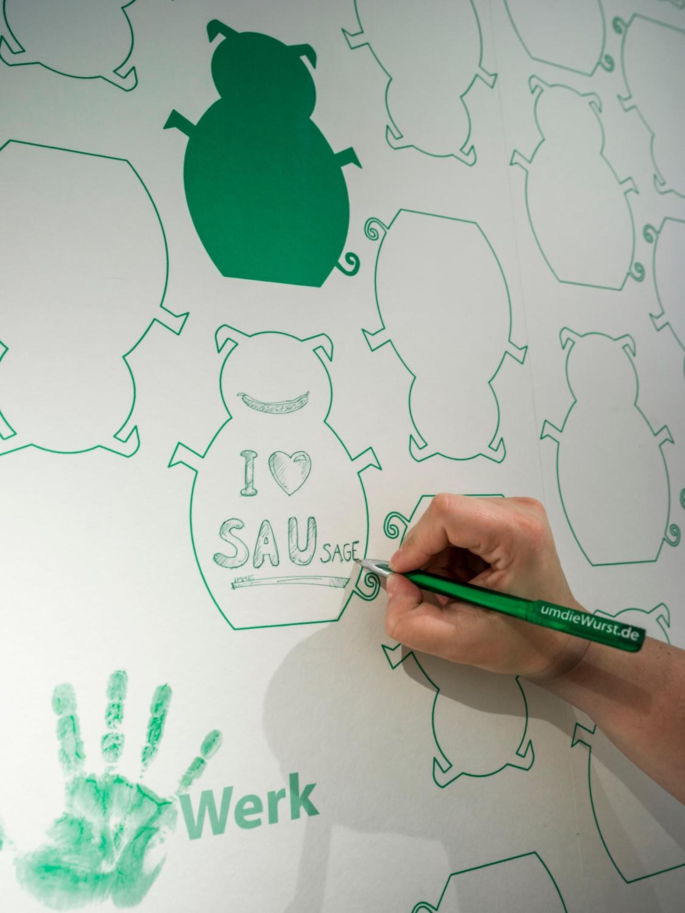 A hand drawing on a whiteboard with green outlines of various shapes and the text "I ♥ SAU SAGE".
