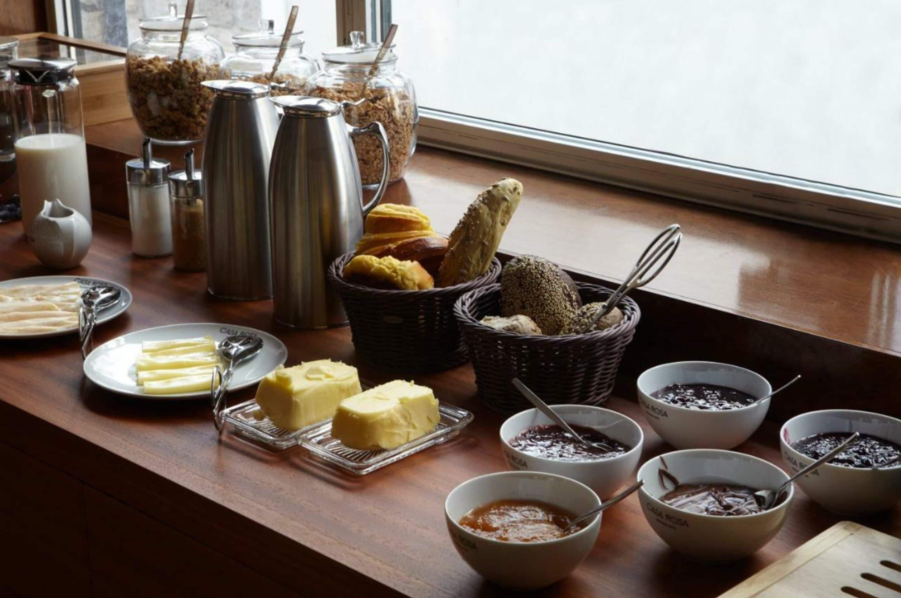 A breakfast buffet with various food items and condiments.