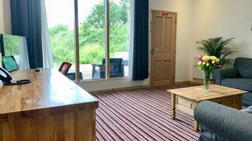 Premium Suite, 2 Bedrooms, Balcony, Lake View | Living area | 55-inch flat-screen TV with digital channels, TV, Netflix