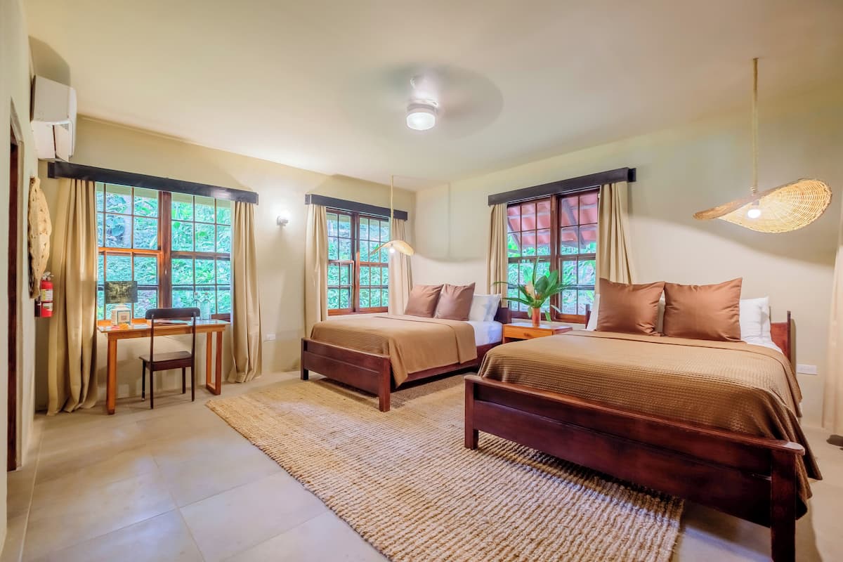 Deluxe Bungalow, 2 Queen Beds, Terrace, Garden View | 2 bedrooms, premium bedding, individually decorated, blackout drapes