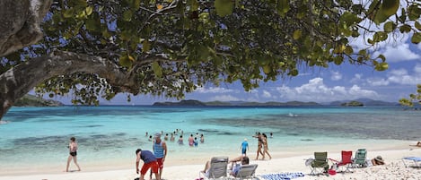 On the beach, sun loungers, beach towels