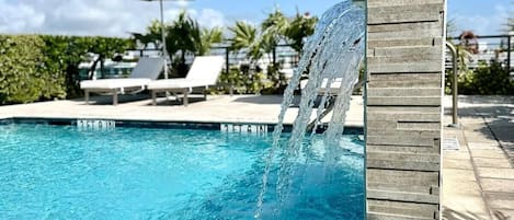 Outdoor pool, open 9:00 AM to 9:00 PM, pool umbrellas
