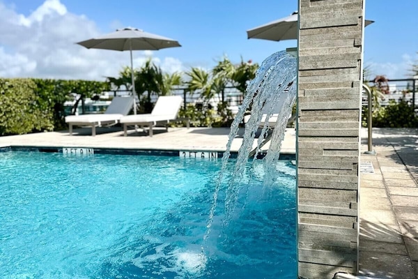 Outdoor pool, open 9:00 AM to 9:00 PM, pool umbrellas