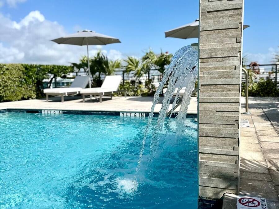 Outdoor pool, open 9:00 AM to 9:00 PM, pool umbrellas