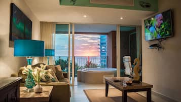 Departamento de lujo, 1 cama Queen size, vista al océano | Sala de estar | Televisión LED
