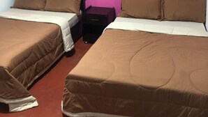 A room with two beds, each with brown bedding and black headboards, against a pink wall. - White Cottage Nuwara Eliya (Nuwara Eliya)