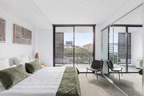 Desk, laptop workspace, blackout curtains, iron/ironing board