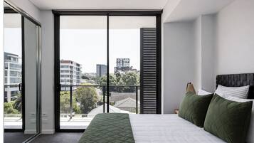 Desk, laptop workspace, blackout curtains, iron/ironing board