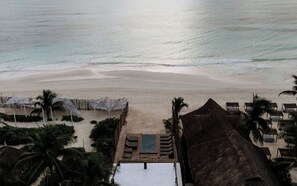 On the beach, sun-loungers, beach towels