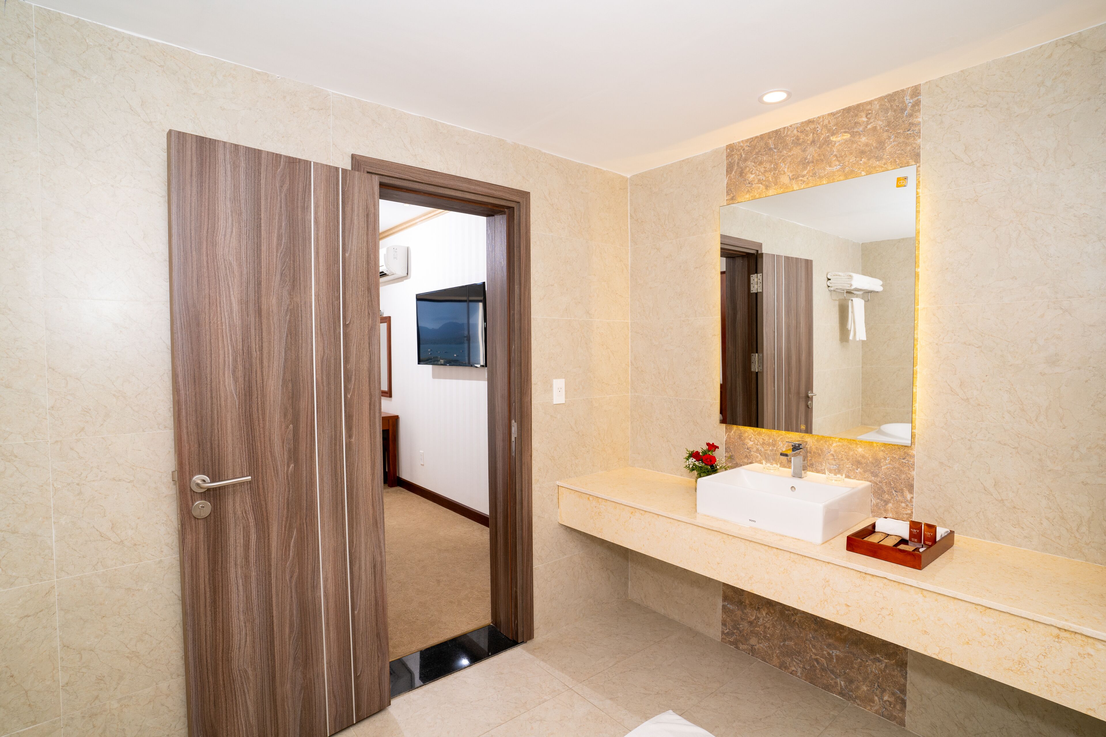 navy suite king | bathroom | free toiletries, hair dryer, slippers, towels