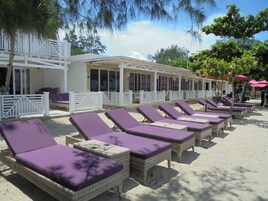 On the beach, white sand, free beach cabanas, sun loungers