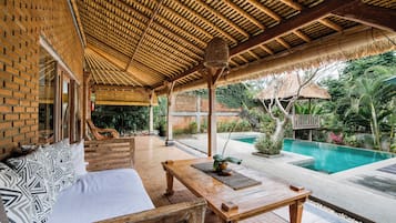 Honeymoon Villa, 1 Bedroom, Pool View | Living area | Flat-screen TV