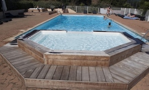 Seasonal outdoor pool, open 8 AM to 8 PM, pool umbrellas, pool loungers