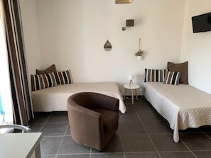 Apartment, 1 Bedroom | Living room | Flat-screen TV