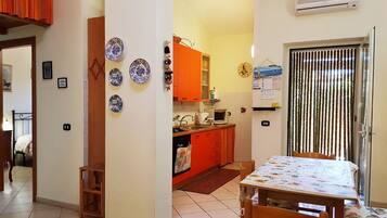 Apartment, 3 Bedrooms | Private kitchen | Full-sized fridge, stovetop, cookware/dishes/utensils