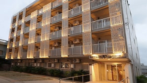 A multi-story hotel with balconies, air conditioning units, and a sign indicating it is the WBF MARGINA HOTEL. - The BREAKFAST HOTEL MARCHE Ishigakijima (Ishigaki)