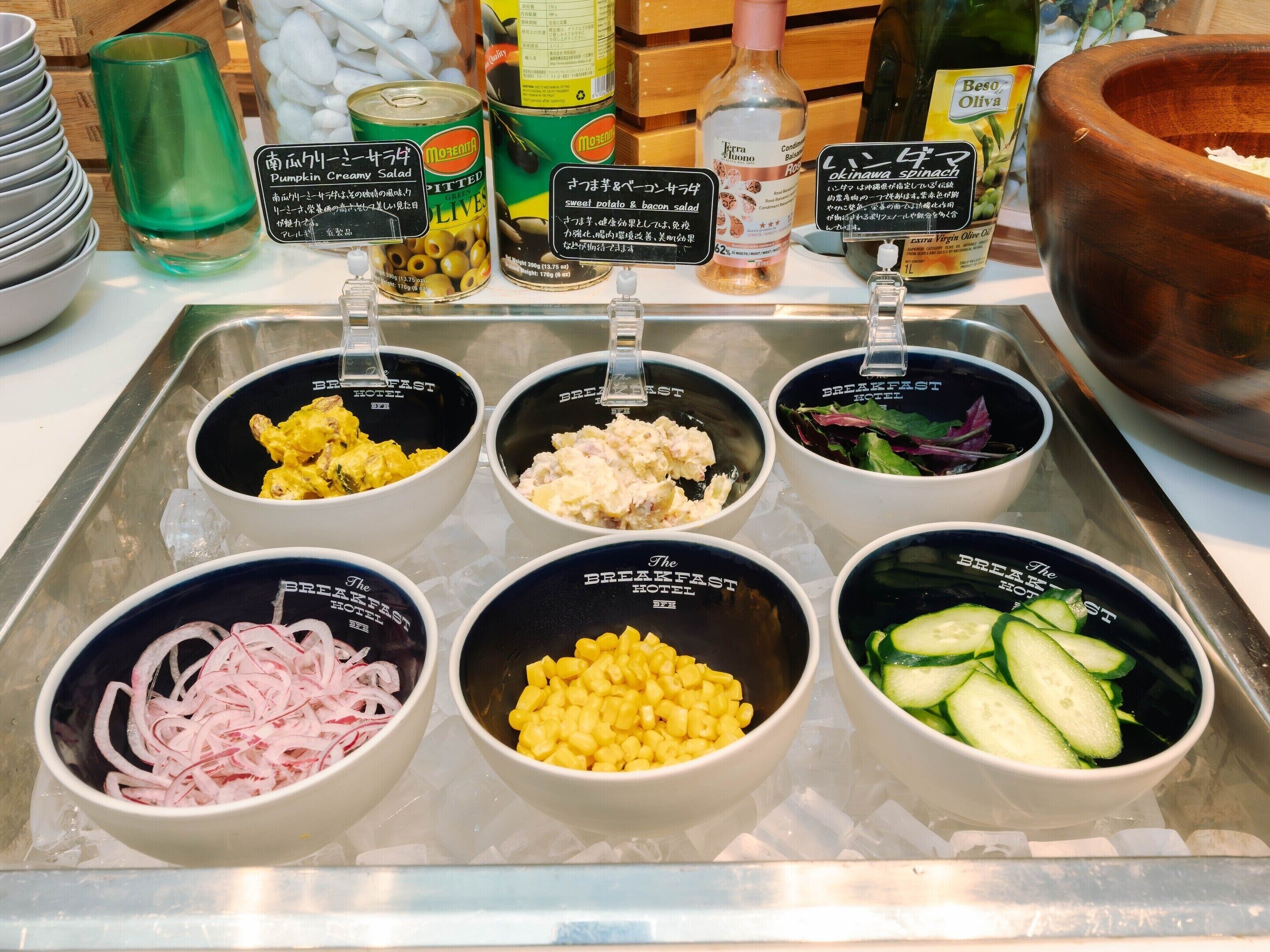A breakfast buffet with various food options and condiments.