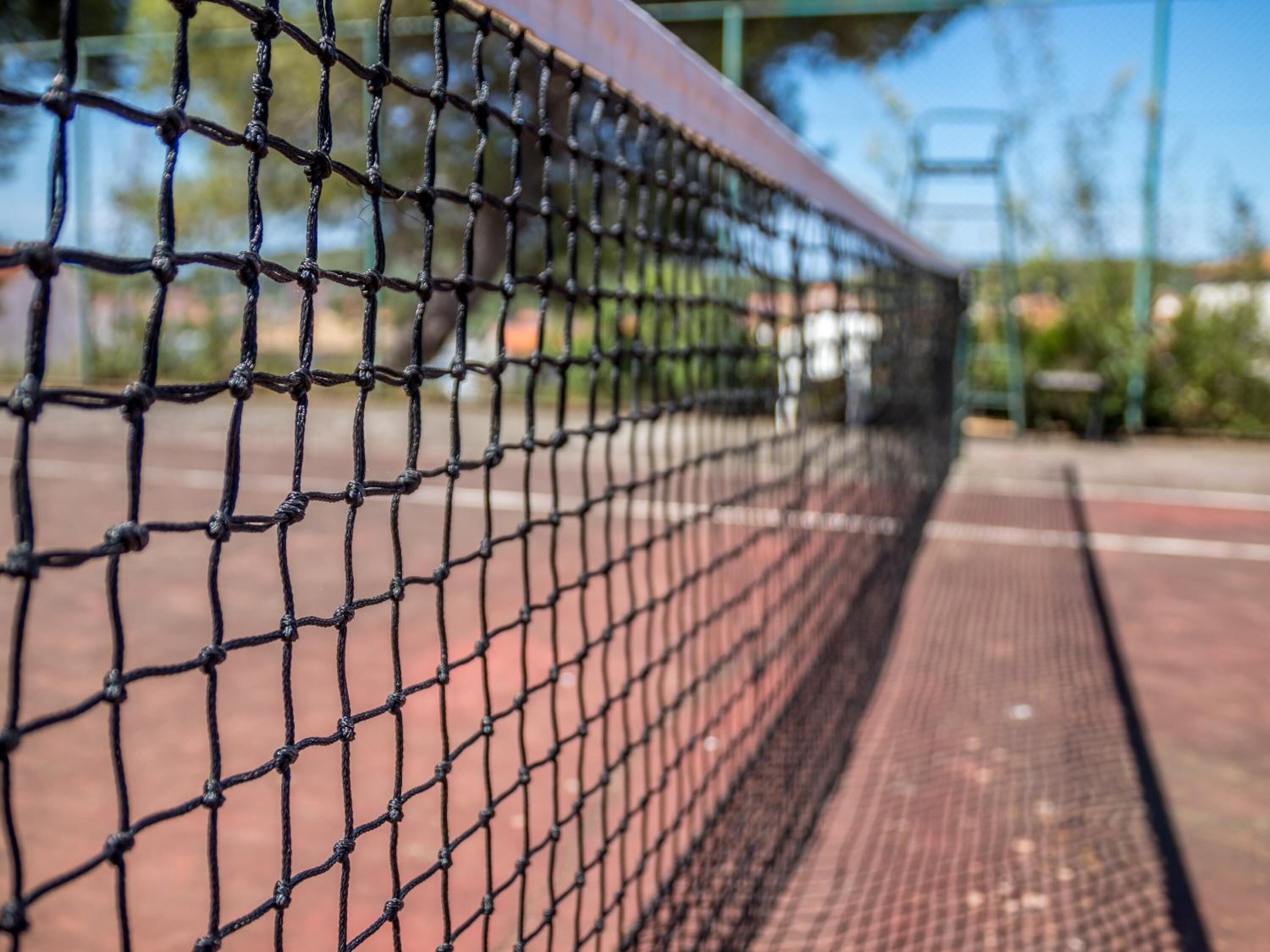 A close-up of a tennis court net.