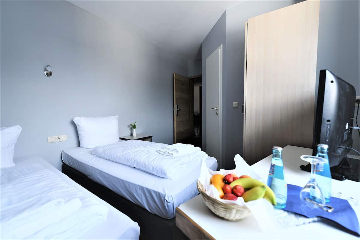 Premium bedding, desk, blackout drapes, iron/ironing board (on request)