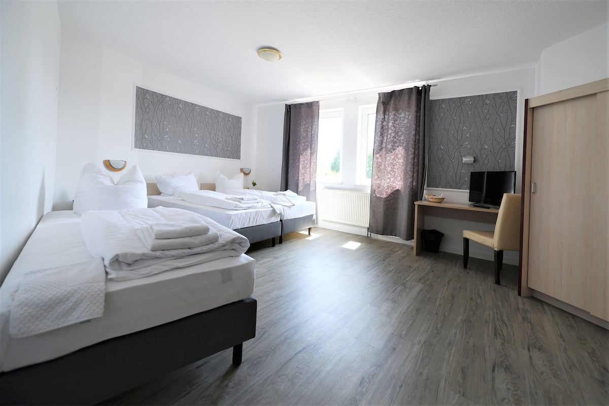 Premium bedding, desk, blackout drapes, iron/ironing board (on request)