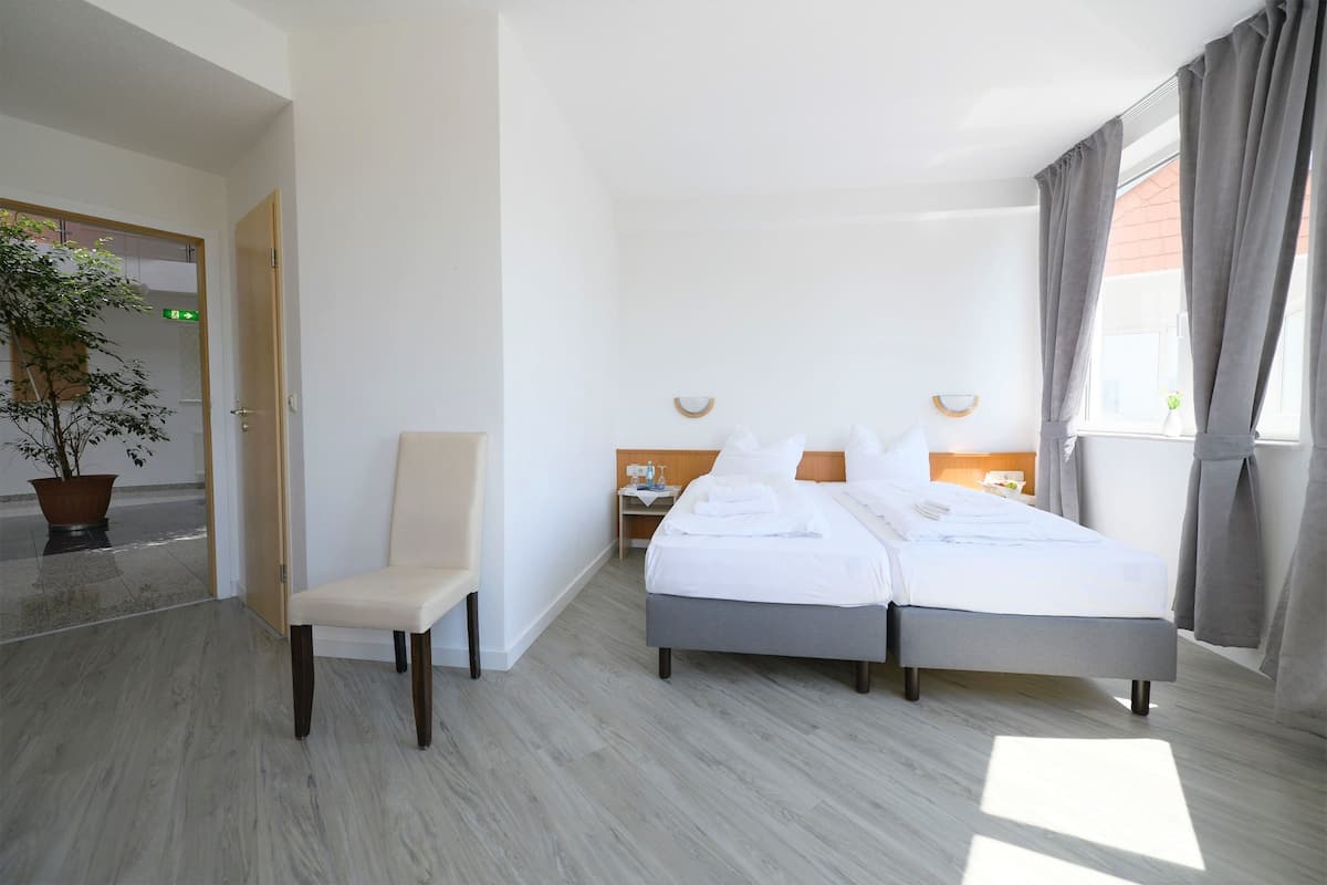 Premium bedding, desk, blackout drapes, iron/ironing board (on request)