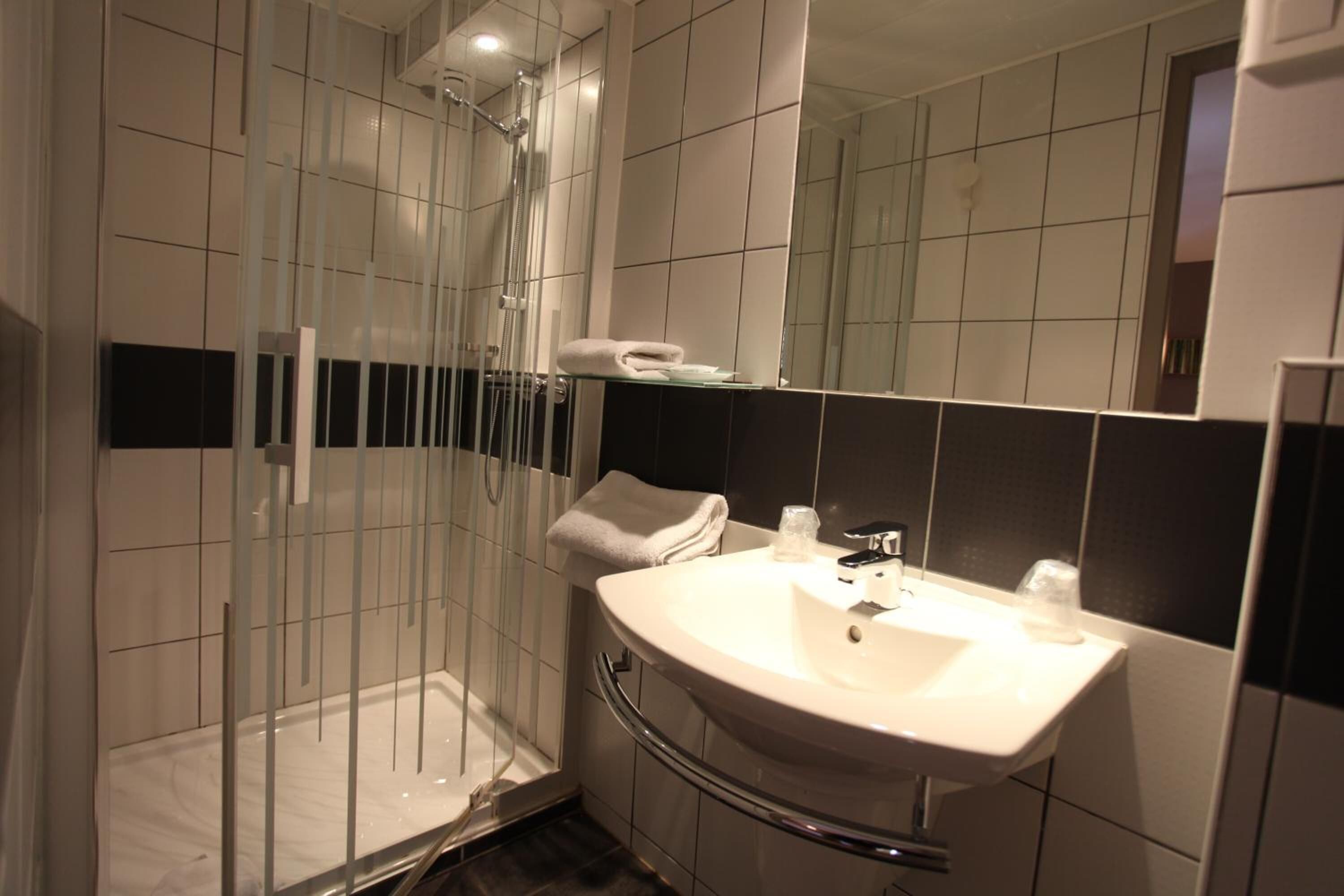 deep-soaking bathtub, rainfall showerhead, free toiletries, hair dryer