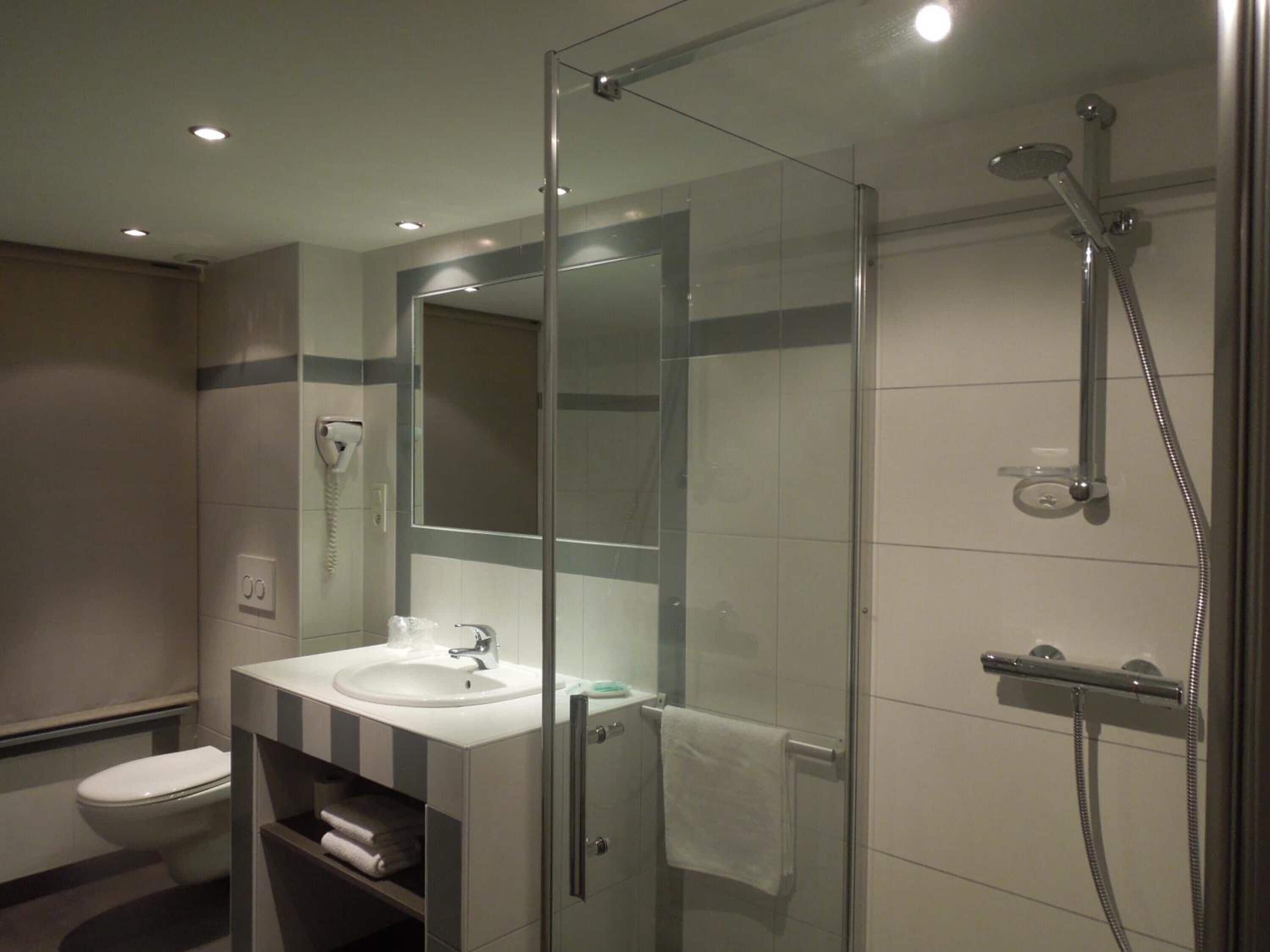 deep-soaking bathtub, rainfall showerhead, free toiletries, hair dryer