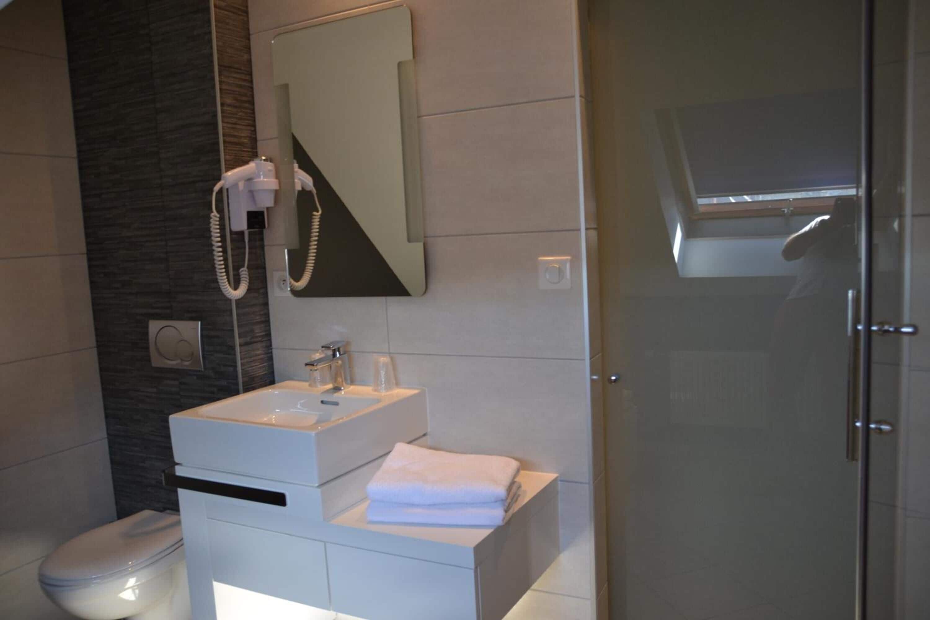 deep-soaking bathtub, rainfall showerhead, free toiletries, hair dryer