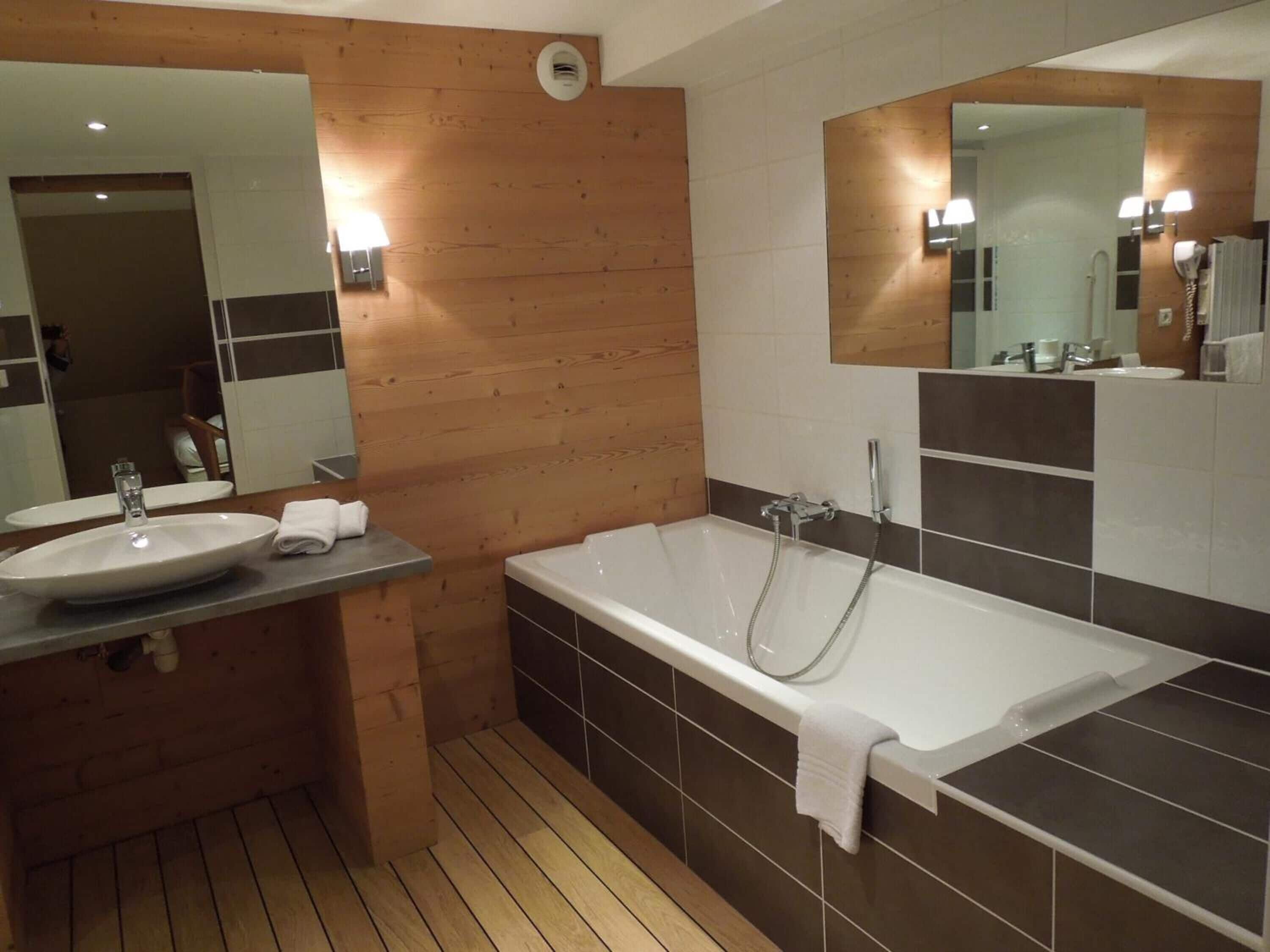 deep-soaking bathtub, rainfall showerhead, free toiletries, hair dryer