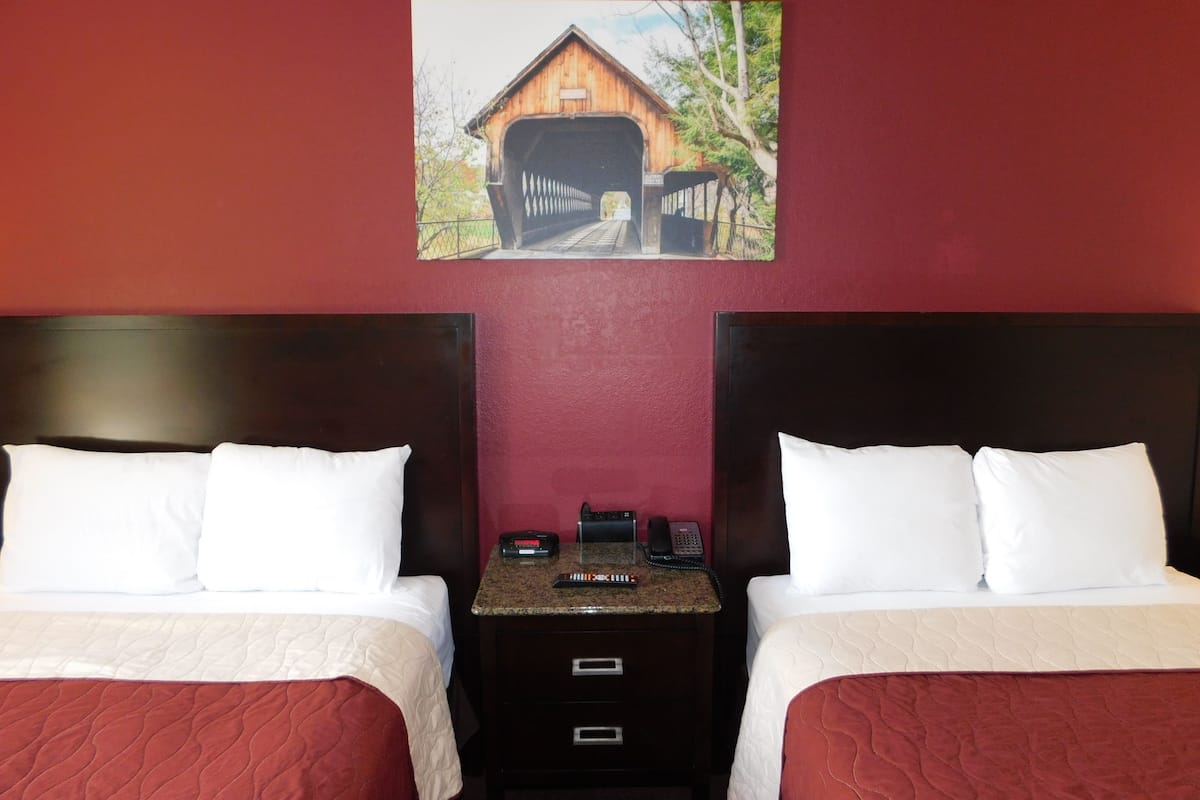 standard double room, 2 double beds, refrigerator & microwave | 1 bedroom, individually decorated, individually furnished, desk