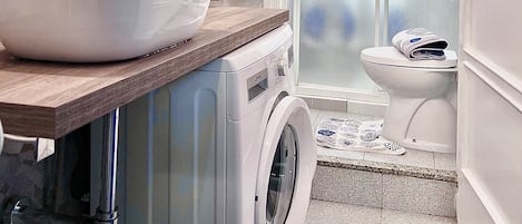 Shower, hair dryer, towels, soap