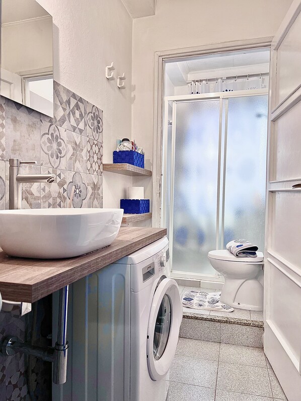 Shower, hair dryer, towels, soap