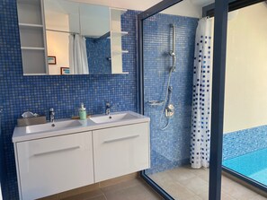 Shower, hair dryer, towels, soap