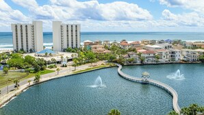 A coastal resort with a marina, two tall buildings, and a variety of residential structures. - Perfect family retreat! Large deck for relaxing the sun! (Destin)