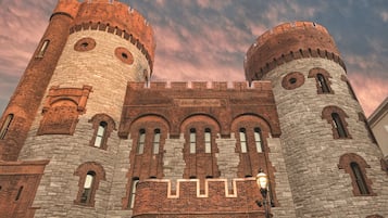 A historic building with two prominent towers and a central entrance.