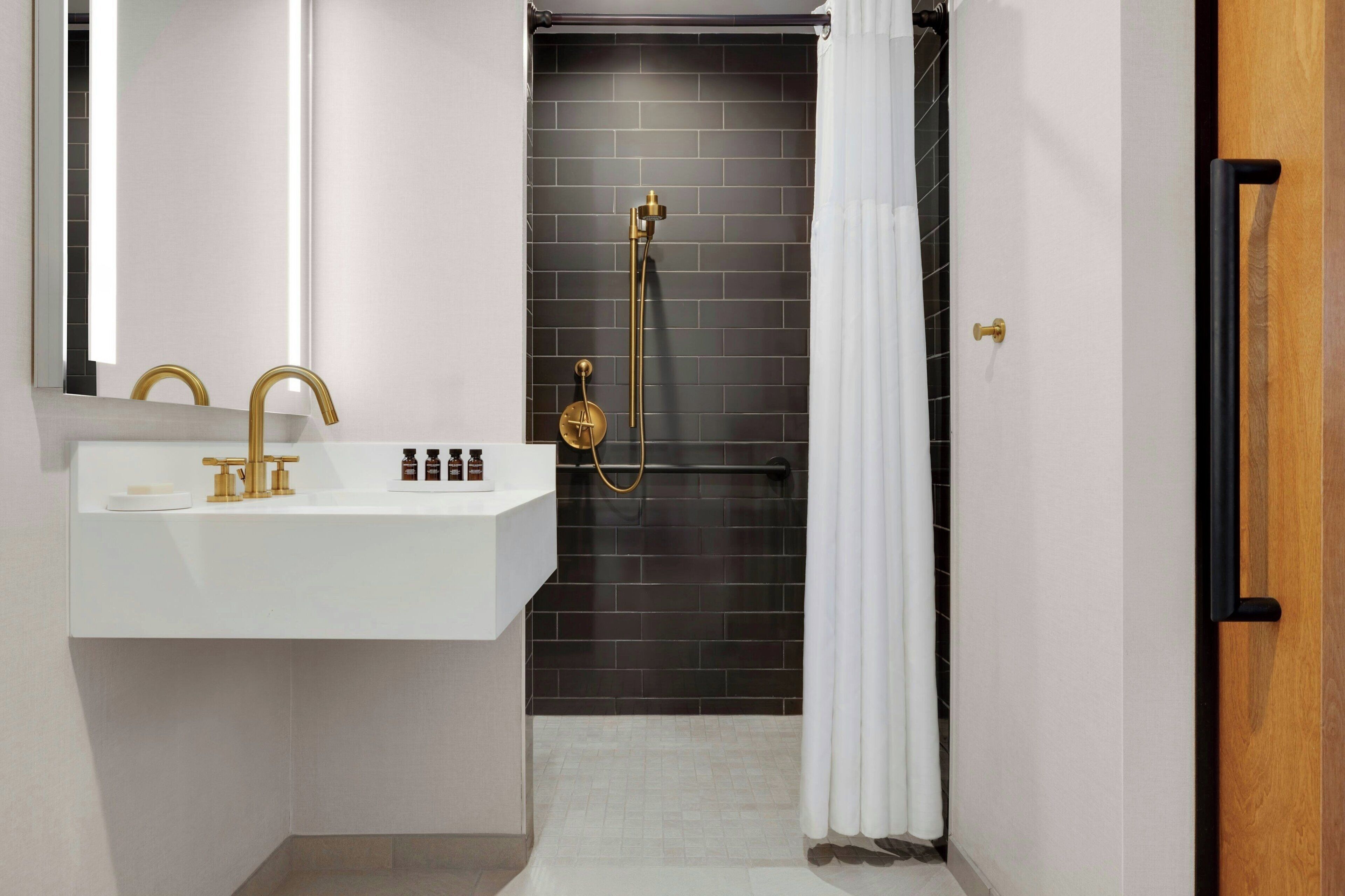 room, 1 queen bed | bathroom | rainfall showerhead, designer toiletries, hair dryer, towels