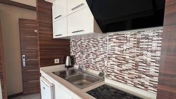 Fridge, stovetop, electric kettle, griddle