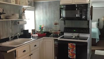 Fridge, microwave, stovetop, coffee/tea maker