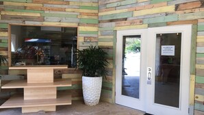 A wooden interior with a counter, a door, and a staircase. - Corner Villa with Stunning Sapphire Bay Views – Sleeps 6 w/Backup Generator. (St Thomas)