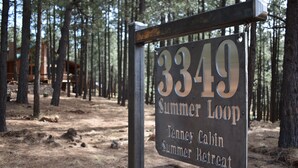 A sign for the Tenney Cabin Summer Retreat at Summer Loop, marked as 3349.