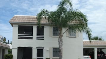 Stylish two-story home with a front yard and garage.