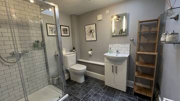 Shower, hair dryer, towels, soap